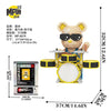 A small bear figure made of wooden building blocks with black sunglasses and a yellow backpack.