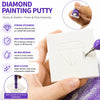 A hand holds a white canvas with a diamond painting design, showing the sticky and stable paint putty tool.