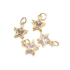 Three gold-toned star charms with clear rhinestones and jump rings for jewelry making
