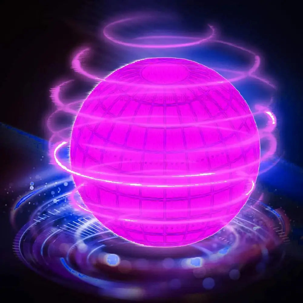 A glowing magenta sphere surrounded by blue light rings, suggesting an LED flying ball boomerang.