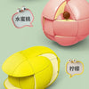 A pink fruit-shaped 3x3 puzzle cube for kids shown next to a yellow tennis ball and speech bubbles.