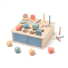 A wooden Montessori sorting box with various colored and shaped wooden blocks and tools.