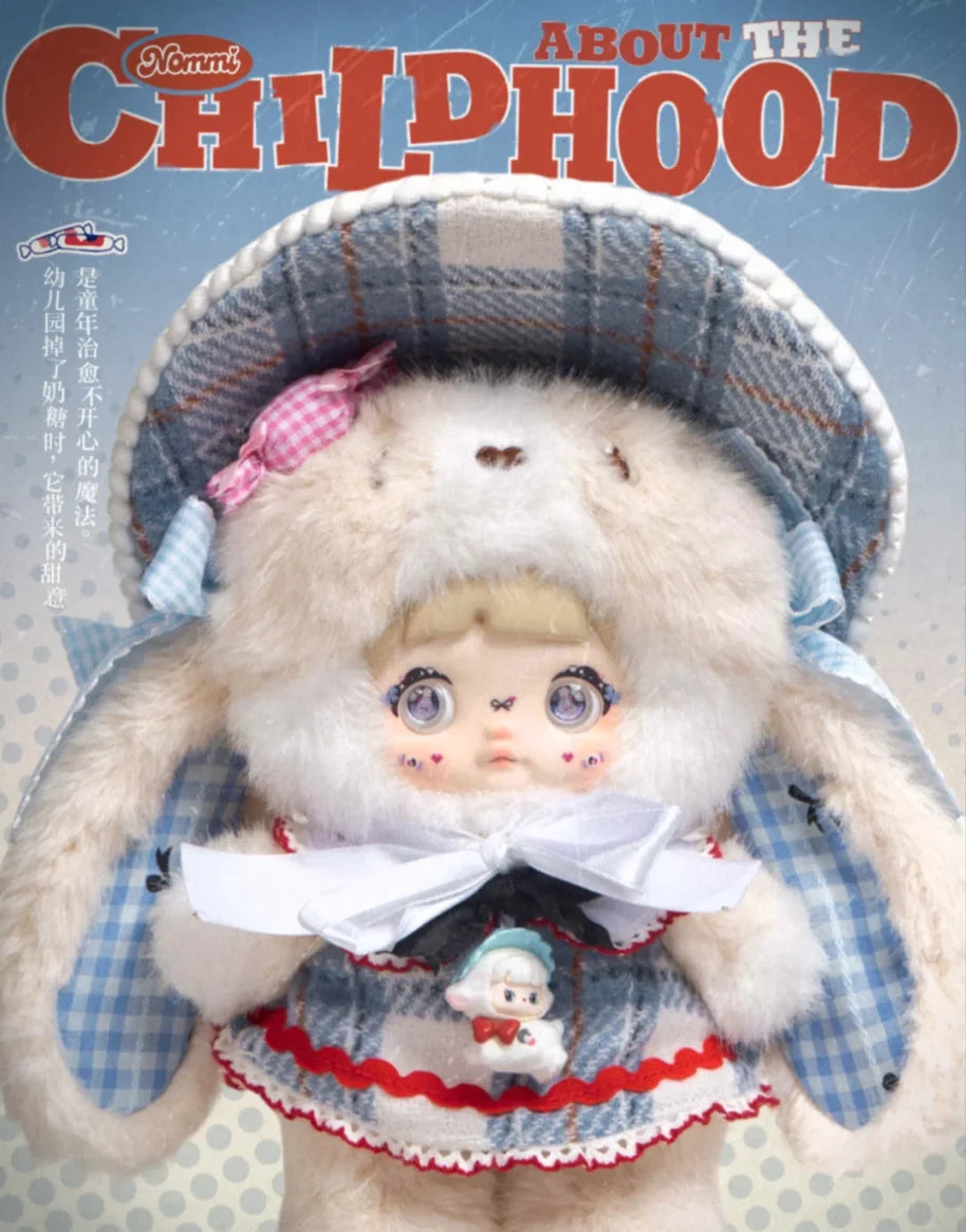 A fluffy doll wearing a plaid hat and traditional clothing is shown in a box art style.