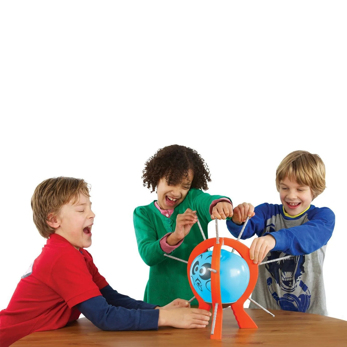 Three children are playing a balloon pop party game around an orange and blue balloon structure.