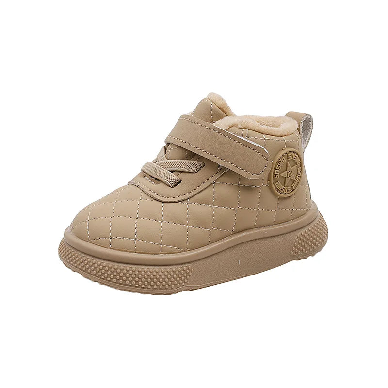 A pair of beige toddler winter snow boots with a quilted upper, soft sherpa lining, and a textured sole.