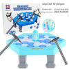 A blue ice table game featuring a penguin figure and ice blocks, with two ice hammers on the table.