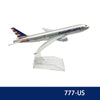 A diecast model of an American Airlines Boeing airplane in silver and red livery.