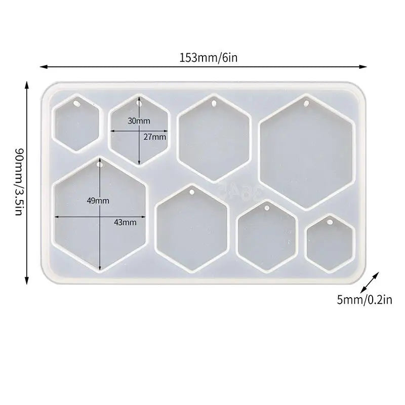 A white silicone mold set with six hexagonal cavities for making epoxy resin jewelry.