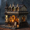 A detailed miniature kit of a wooden magic store cottage with furniture and architectural details.