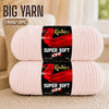 Two skeins of super soft red acrylic yarn are displayed on a light background.