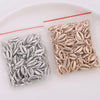 A small clear plastic bag contains 50 plastic seashell charms for jewelry making, featuring bohemian cowrie and conch pendant