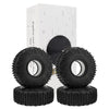 A box containing four black Super Bouncer 1.9 crawler tires stacked on top of each other.