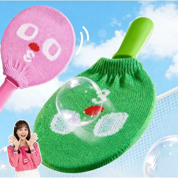 A pink and green handheld smoke bubble wand is shown against a blue sky background.