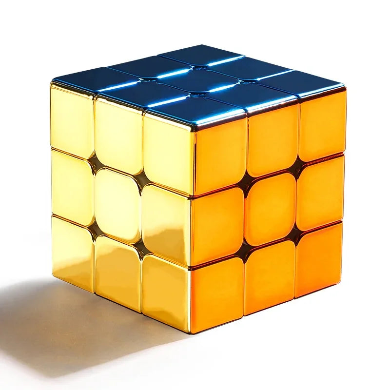 A glossy gold magnetic 3x3 speed cube with blue accents, shown from above.