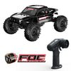 A black 1:18 scale RC rock crawler with four-wheel steering and an attached brushless motor.