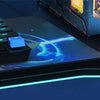 A close-up of a DIY wooden book nook kit featuring a keyboard and glowing blue accents on a dark surface.