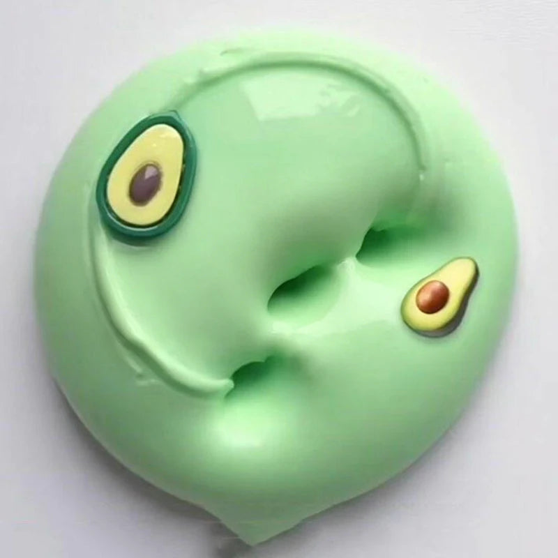 A light green slime with two large, oval eyes, one yellow and the other purple.