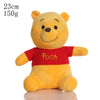 A yellow Winnie the Pooh plush toy with a red shirt and a smiling face.