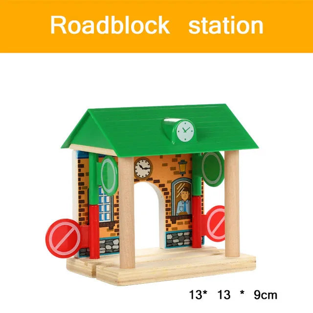 A wooden model of a roadblock station featuring brick walls and a green roof.