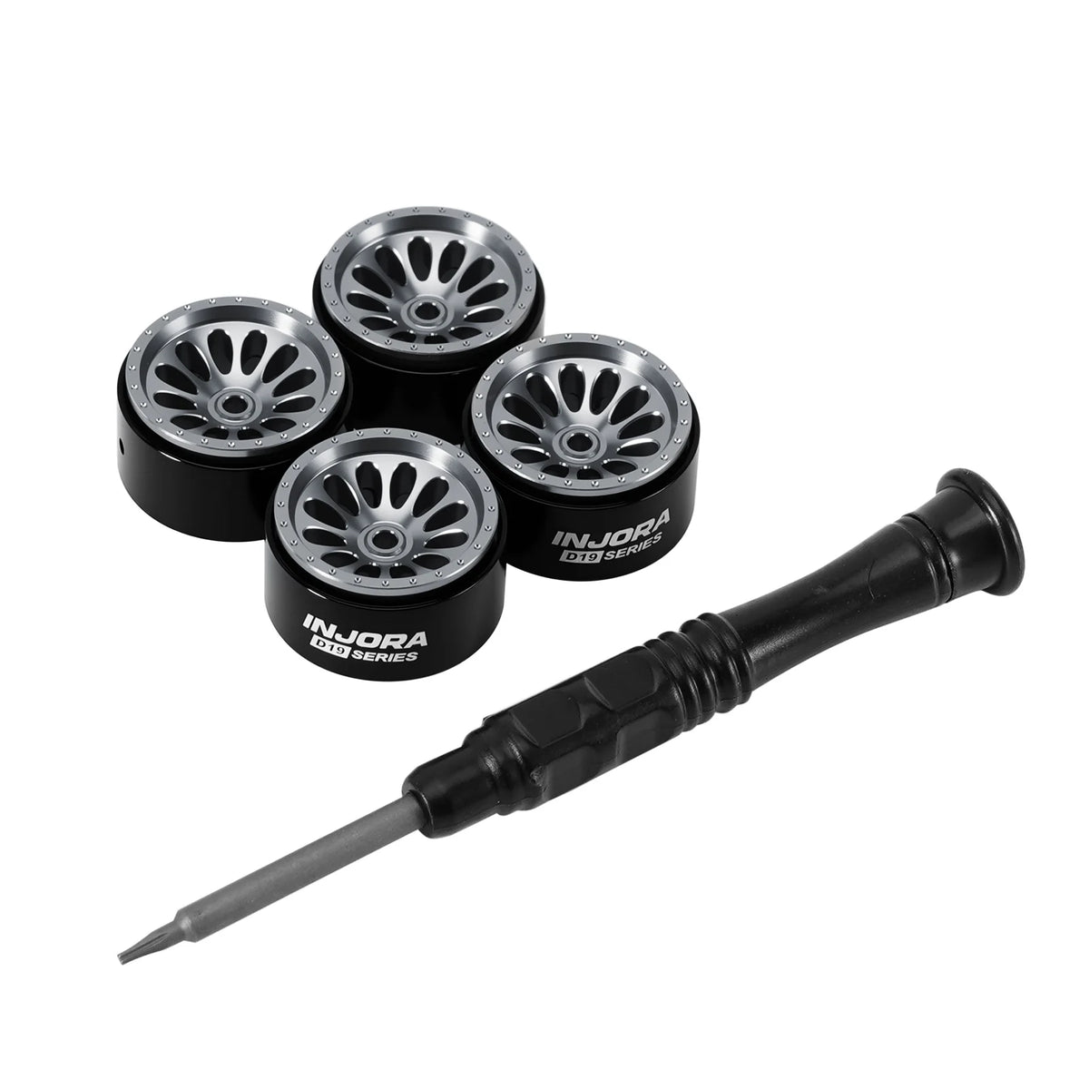 A set of three black aluminum beadlock wheels and a corresponding drill bit for an RC car.