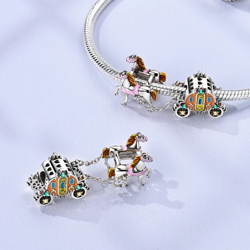 Sterling silver charm bead pendant featuring a horse and carriage design on a bracelet.