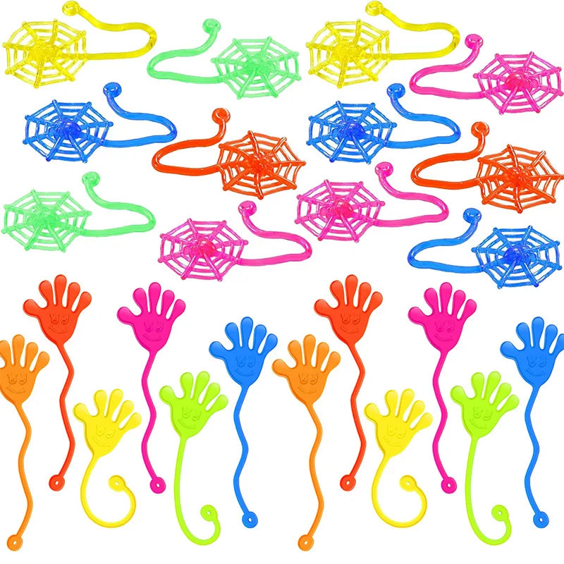A collection of colorful stretchy sticky hands and spider web party favor toys.