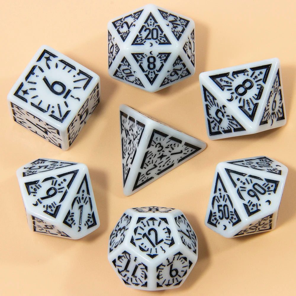 A collection of seven fantasy carved polyhedral dice in white and black on a light background.