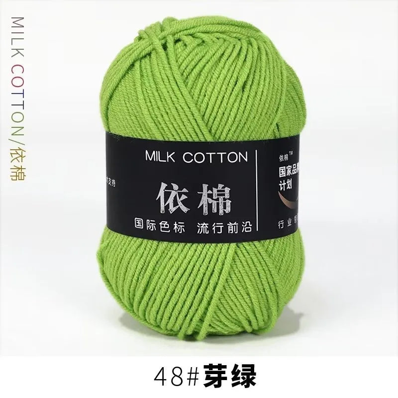 A ball of bright lime green milk cotton yarn labeled with Chinese characters and size 48