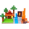 A set of magnetic building tiles depicting a miniature outdoor scene with trees, houses, and landscaping.