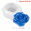White silicone flower mold with a blue rose flower inside.