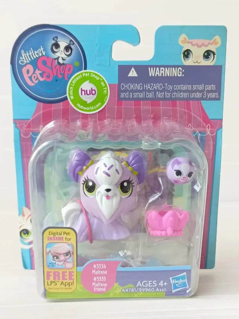 A plastic package containing three small purple and white animal figures for sale.