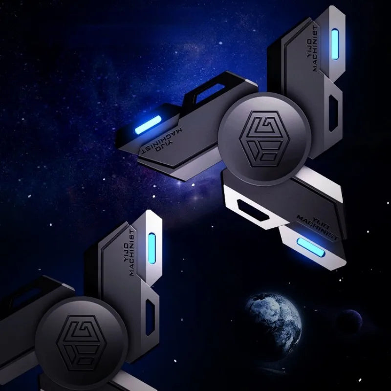 A set of metallic luminous fidget spinners with glowing blue accents against a dark, starry background.