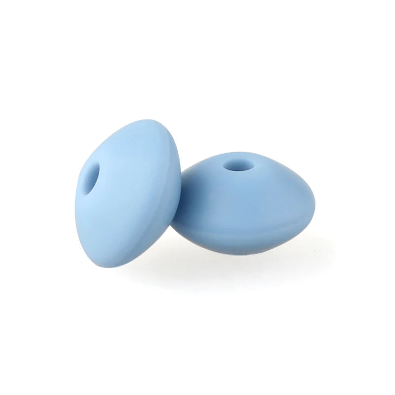 Two smooth, light blue silicone lentil beads shaped like an abacus for jewelry making