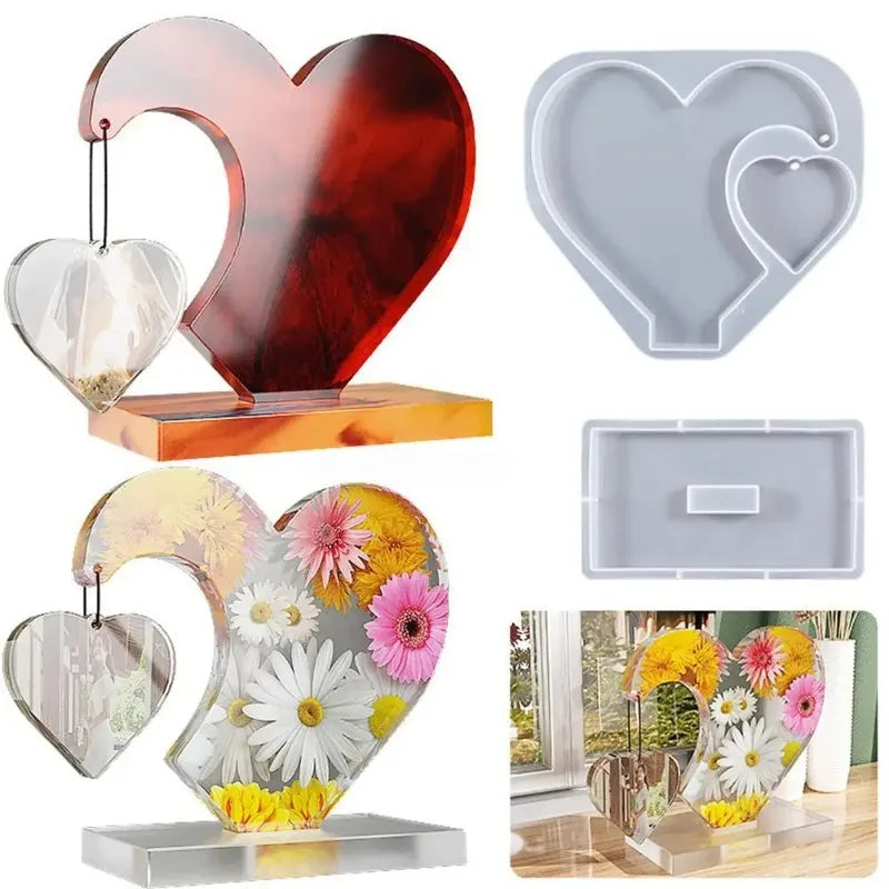 A set of three heart-shaped resin molds for DIY craft gifts, including a large decorative frame and two smaller molds.