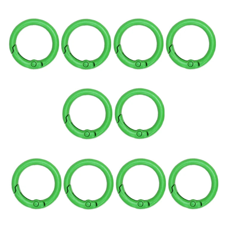 A set of ten bright green alloy snap hook keychain clips arranged in two rows.