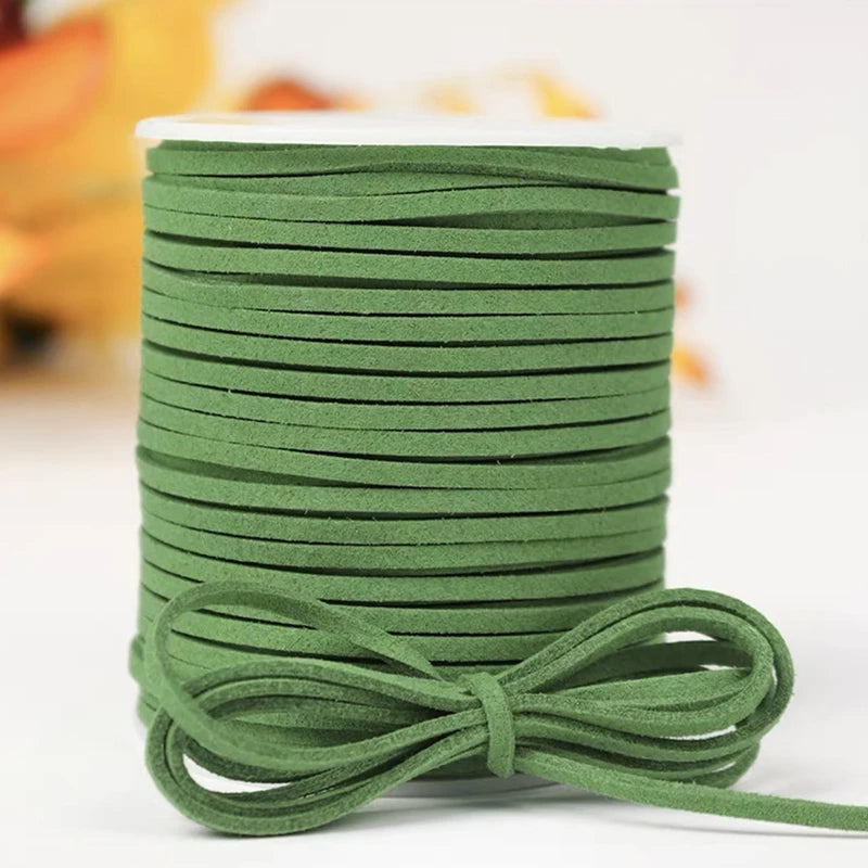 A roll of green velvet faux suede braided ribbon used for crafting and gift wrapping.