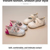 A pair of pink and silver leather slip-on sandals for girls shown on a light background.