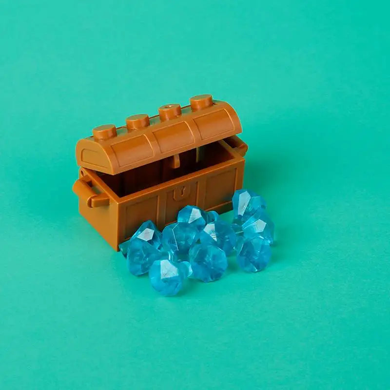 An open building block treasure chest revealing blue gemstone-like crystals.