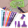 A collection of precision diamond painting pens and replacement tips in various colors are displayed on a textured background