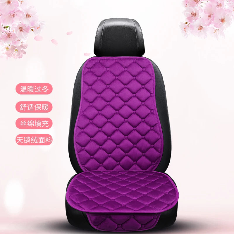 A purple quilted car seat cushion set with black trim shown from the back.