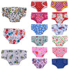 A collection of colorful soft doll underwear in various patterns and colors for dolls.