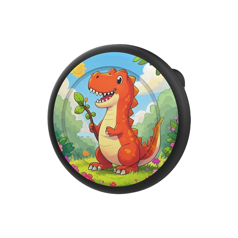 An orange dinosaur illustration on a circular silicone pin holder with a green and yellow background.