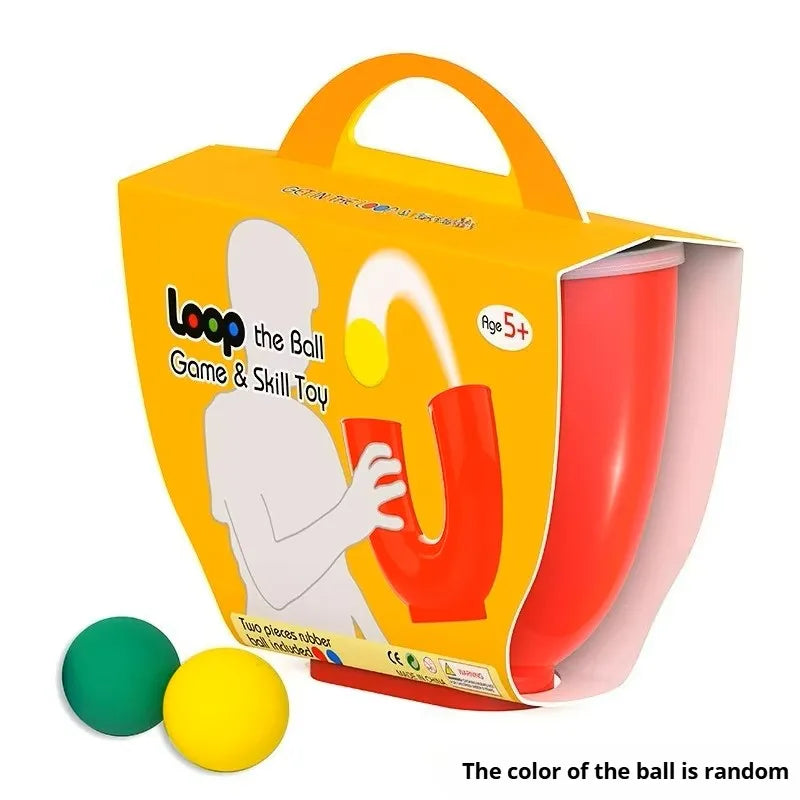 An orange box of a U-shaped juggling ball skill toy with an orange ball and a pink tube visible.