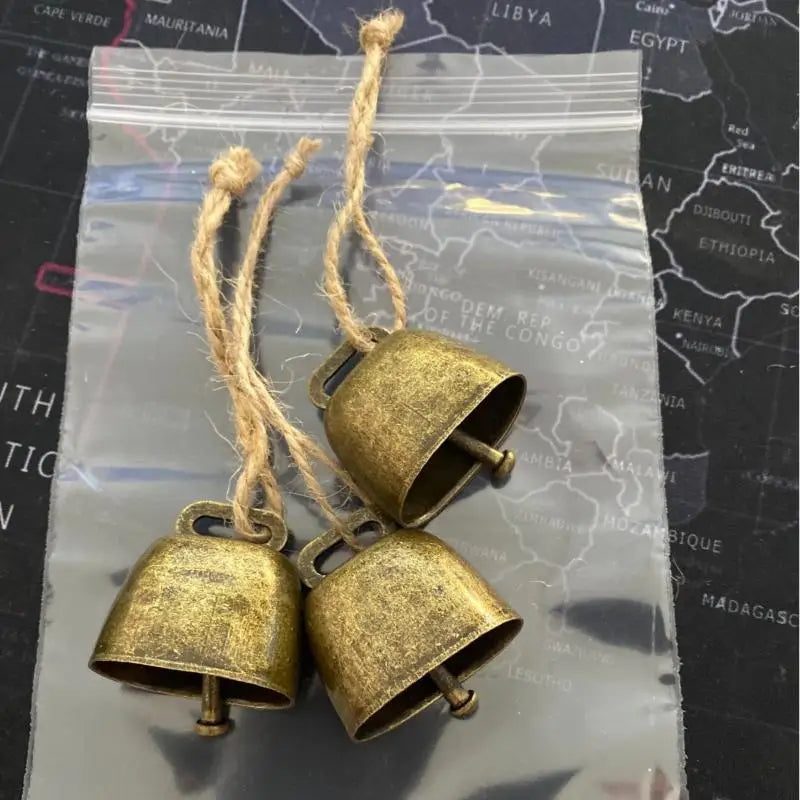 Rustic copper jingle bells with hemp rope for Christmas decor and pet collars