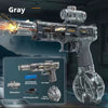 A silver auto-sensor electric water gun with LED lights is shown firing a stream of water in a dark setting.