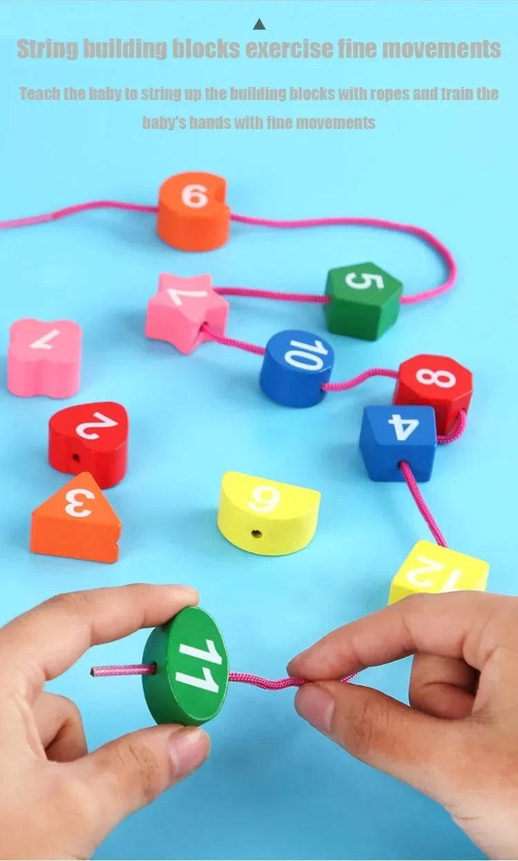 Hands are assembling a string of wooden number and shape blocks with colored ropes for fine motor skill practice.