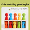 Five colorful wooden dolls are arranged in a box, with instructions for a color matching game.