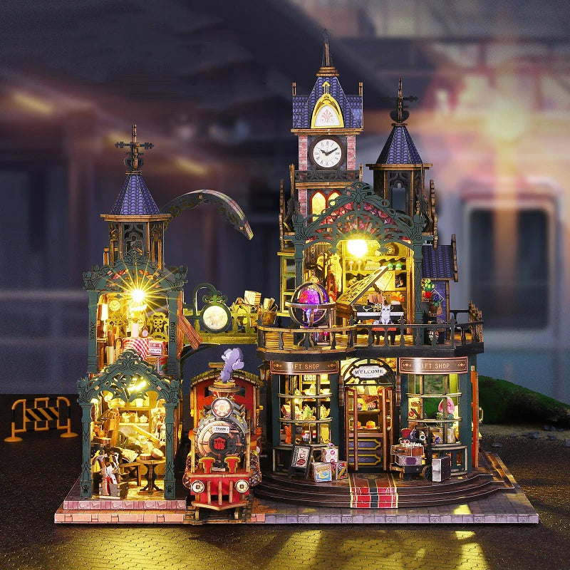 A detailed wooden miniature rail-track city dollhouse kit featuring architecture and furniture.
