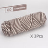 A skein of khaki white striped yarn is shown, packaged as a 3-pack.