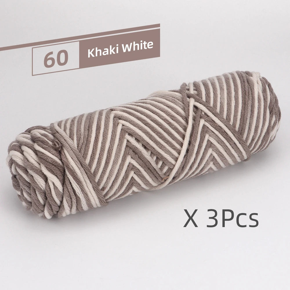 A skein of khaki white striped yarn is shown, packaged as a 3-pack.